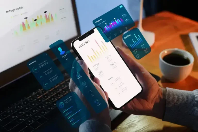 Hands holding phone with analytics dashboard